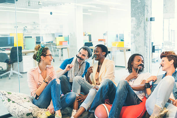 istock Multi-ethnic Young People Celebrating Movember In Their Office. 490370322