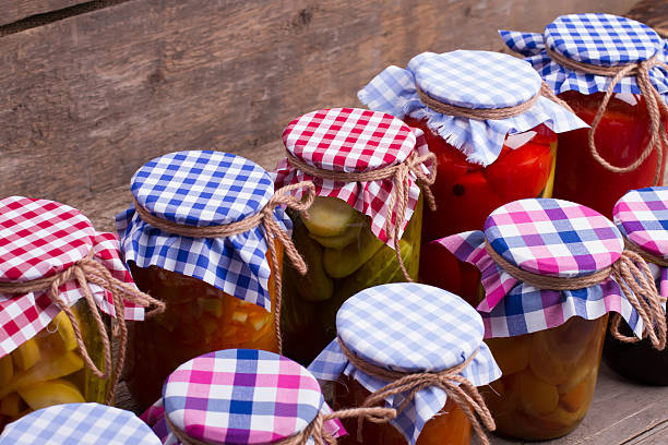 istock Multicolored jars on the old wooden boards. 490372046