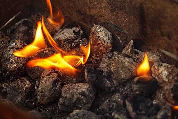 istock Charcoal briquettes ready for barbecue grill. 490372698