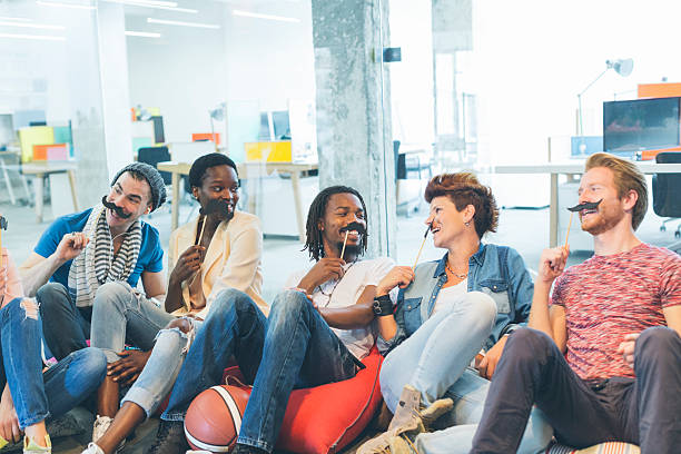 istock Multi-ethnic Young People Celebrating Movember In Their Office. 490372980
