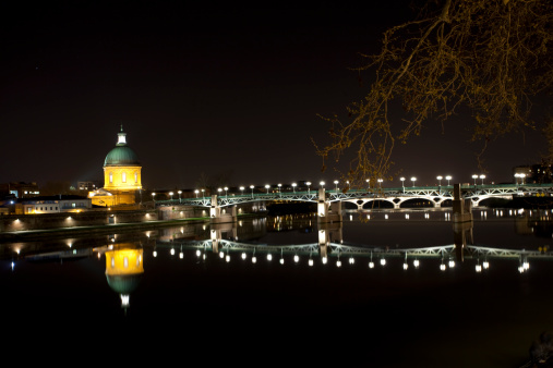 Night on the Garonne river with La Grave dome on the back, Toulouse, France