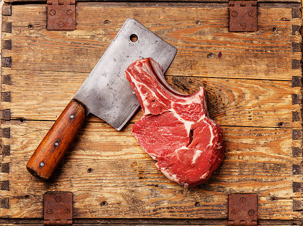 istock Raw meat and meat cleaver 490374643