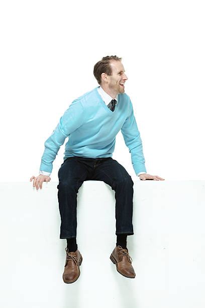 istock Smiling man sitting and looking away 490375107