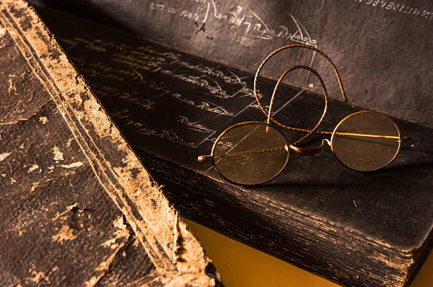 istock Ancient Treatise with very old glasses retro style 490375303