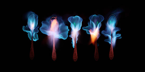 five magic spoon five burning spoons with alcohol, studio shot absinthe spoon stock pictures, royalty-free photos & images