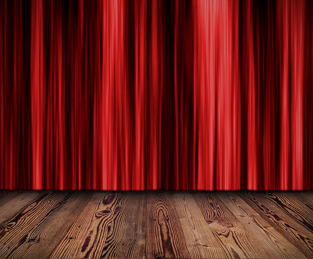 istock Red dark curtain with wooden planks floor 490376281