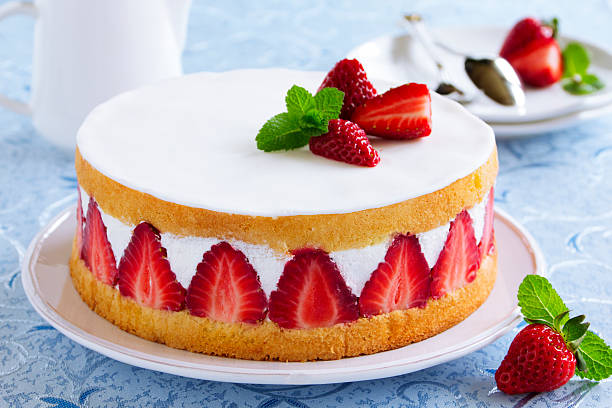 istock Sponge cake with strawberries and vanilla cream. 490377077