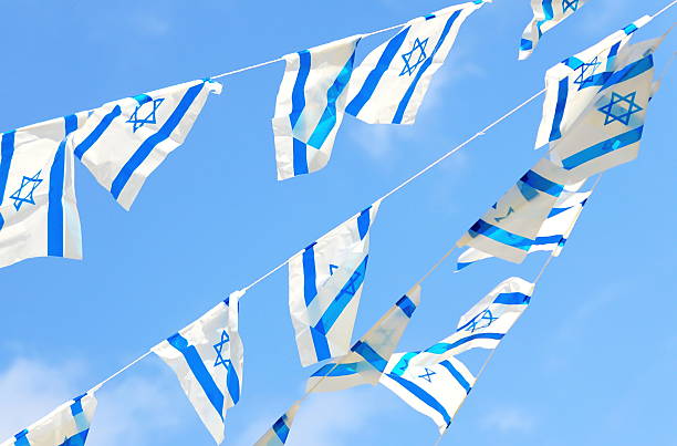 Israel Flags on Independence Day Israeli flags showing the Star of David hanging proudly for Israel's Independence Day (Yom Haatzmaut) israeli flag photos stock pictures, royalty-free photos & images