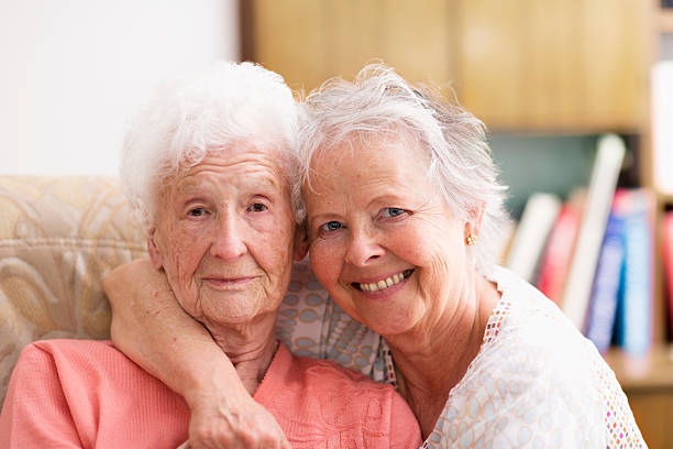 istock two senior women togetherness love 490378379