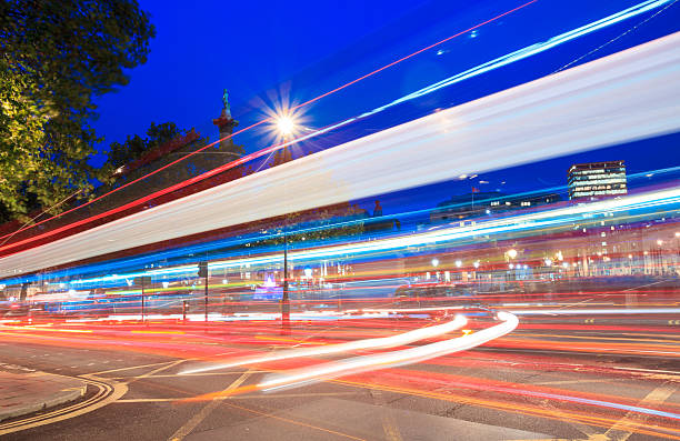 istock London city skyline - blue night trailing lights 490380451