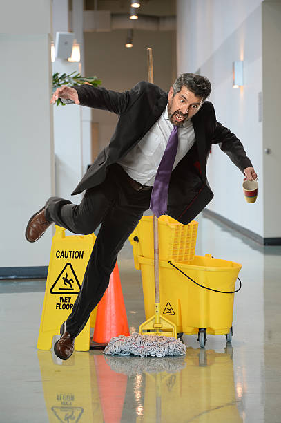 istock Businessman Falling on Wet Floor 490390042