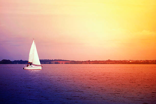 istock white yacht and beautiful sunset 490390312