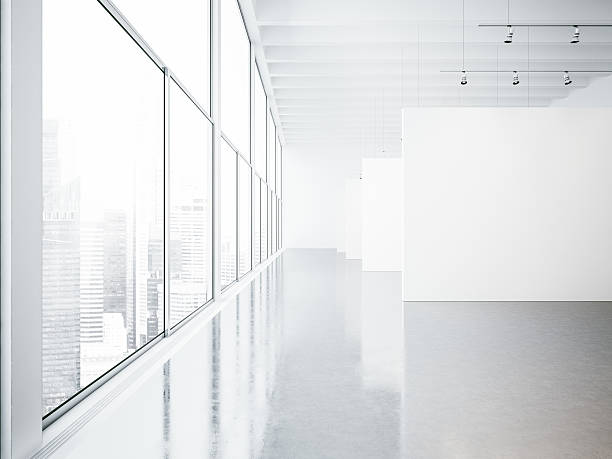 istock Mock up of empty white gallery interior and big windows 490393364