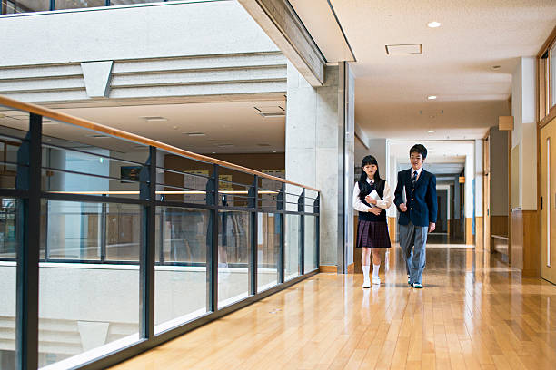 istock Japanese students walking in the school corridors 490396428
