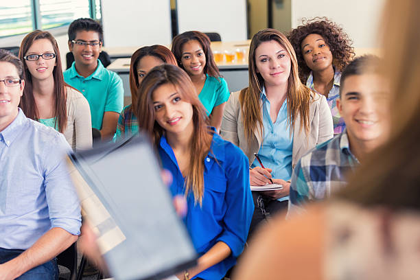 istock Diverse group of college students in lecture or orientation meeting 490398364