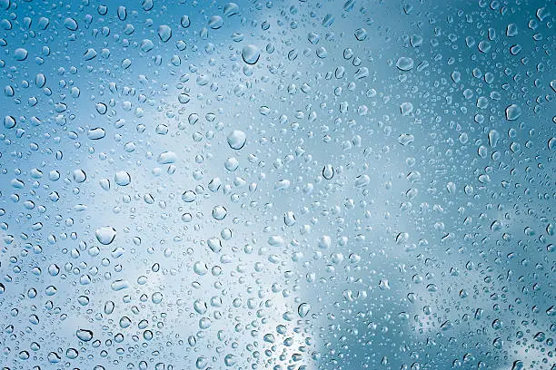 Photo of Drops of rain on glass , rain drops on clear window