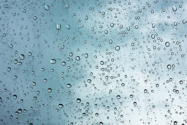 istock Drops of rain on glass , rain drops on clear window 490400254