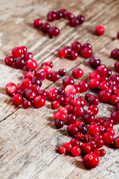 istock Fresh cranberry on old wooden table 490401880