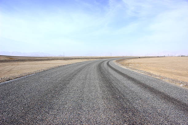Asphalted road and the blue sky