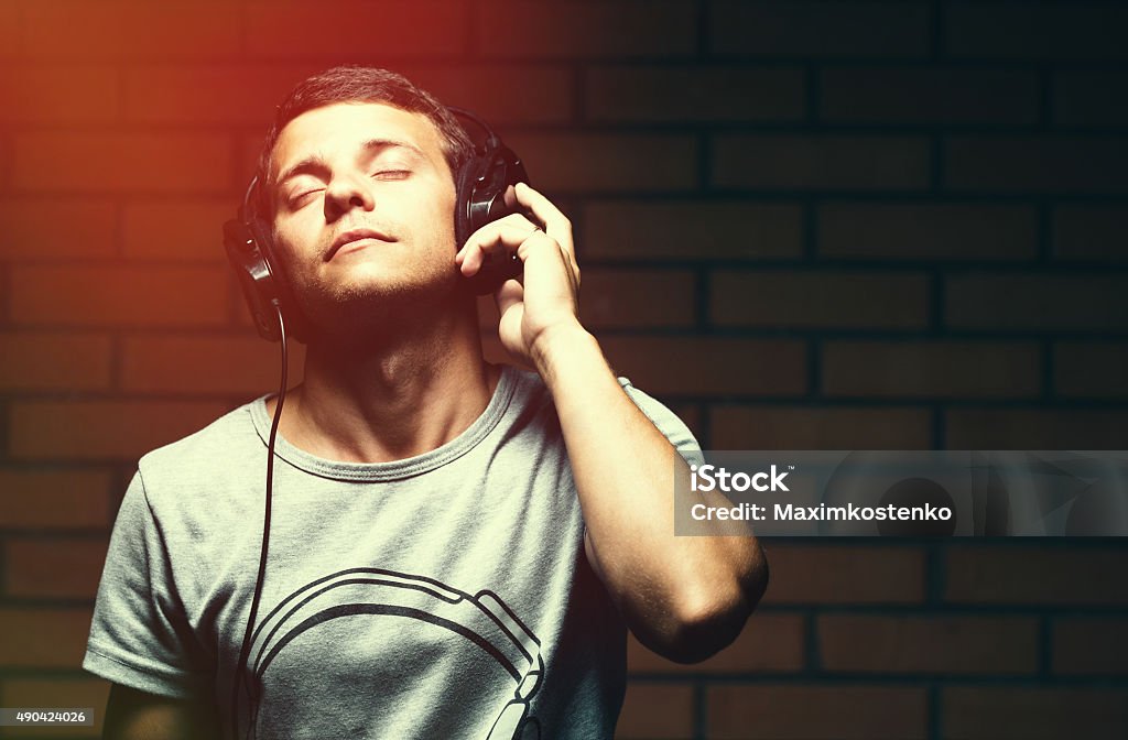 Portrait of a handsome young man listening to music Music Stock Photo