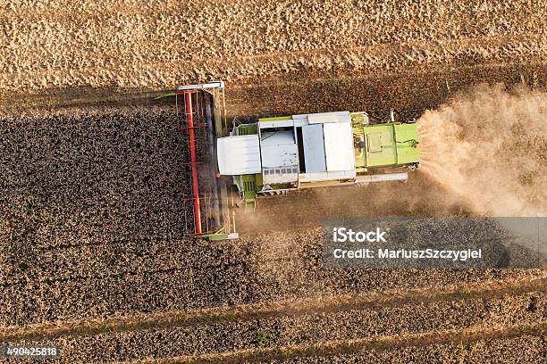 Aerial View Of Combine On The Harvest Field Stock Photo - Download Image Now - Combine Harvester, Wind, 2015