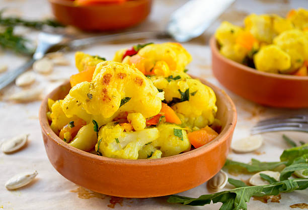 istock Cauliflower curry with pumpkin, paprika and arugula 490427074