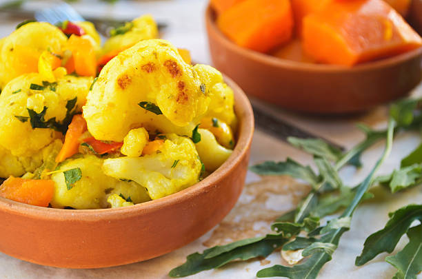 istock Cauliflower curry with pumpkin, paprika and arugula 490427118