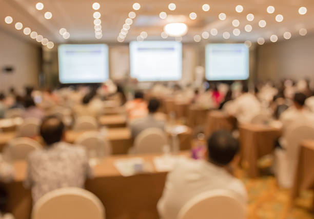istock Blurred image of people in auditorium , blur with bokeh 490430760