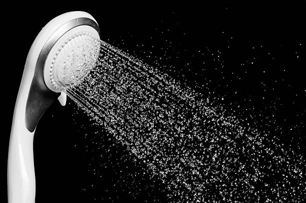 istock Modern shower head with running water isolated 490431628