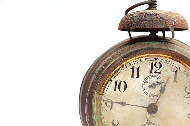 istock Dial of old alarm clock closeup isolated on white 490433578