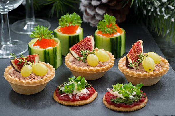 istock Set of festive Christmas mini appetizers on dark background 490436096