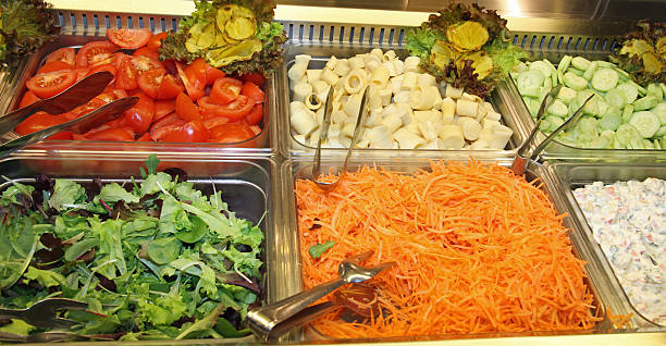 istock steel trays with fresh vegetables in a self-service restaurant 1 490452767