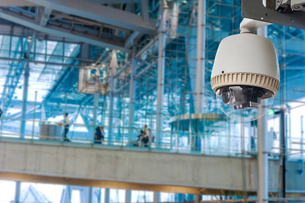 istock CCTV camera or surveillance operating with electric door in background 490453423