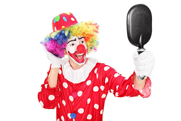 istock Male clown looking in a mirror 490456617