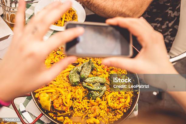 Taking A Photo Of Spanish Paella On Smartphone Stock Photo - Download Image Now - Adult, Adults Only, Camera - Photographic Equipment