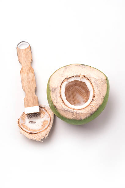 istock Coconut grater isolated with coconut 490473064