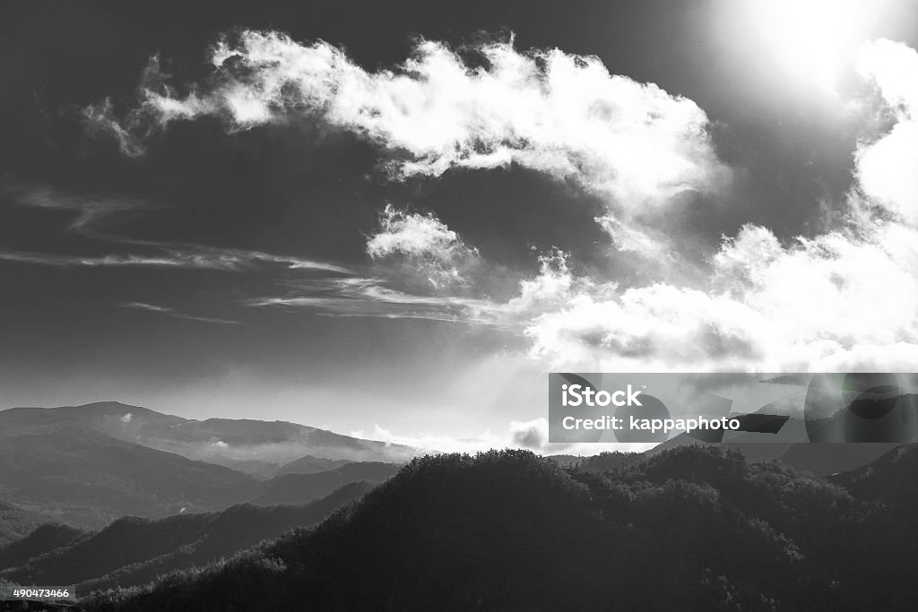 Clouds on black and white Clouds flowing trought the sky, ligten from behind. 2015 Stock Photo