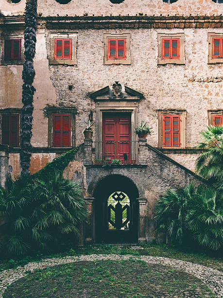 istock Abandoned Italian house with red windows 490473936