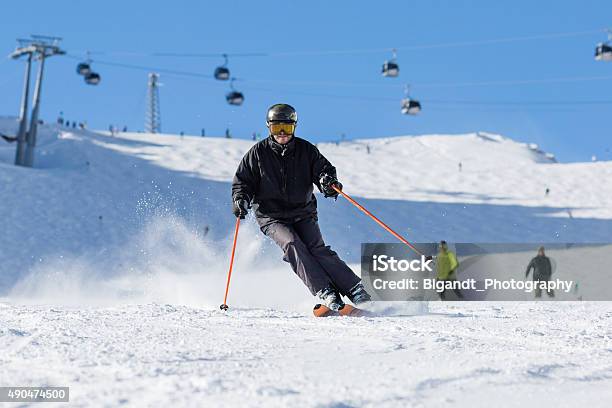 Skier Skiing On Ski Slope Stock Photo - Download Image Now - 2015, Adult, Austria