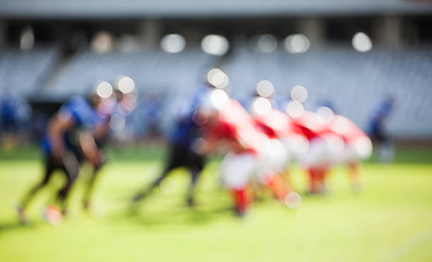 american-football-spiel-out of focus hintergrund - football american football professional sport football player stock-fotos und bilder