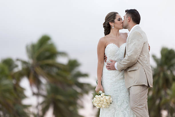 istock Bride and groom kissing 490475560