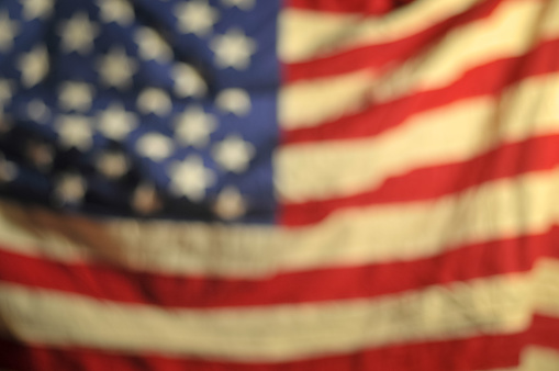 Stock photo of an out of focus United States flag