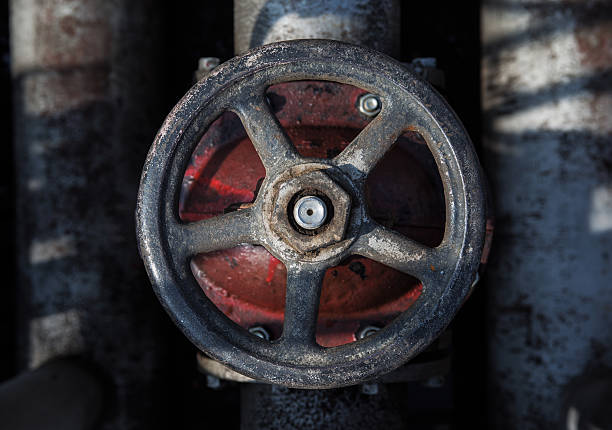 top view on old handwheel of valve in a dark background