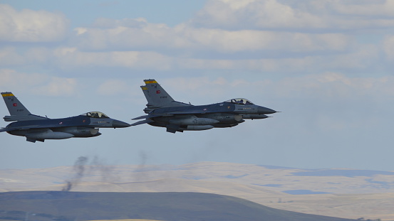 Ankara, Turkey - September 13, 2015: Turkish Air Force's 3 F-16 Falcon is at the air show over Dua Hill in near capital city Ankara where Turkish Independence war began to forward, in September 13th, 2015