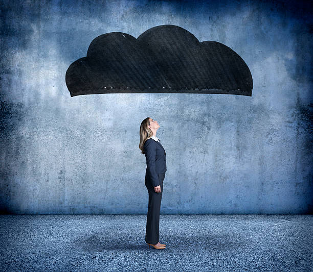 istock Businesswoman Under A Dark Cloud 490479478