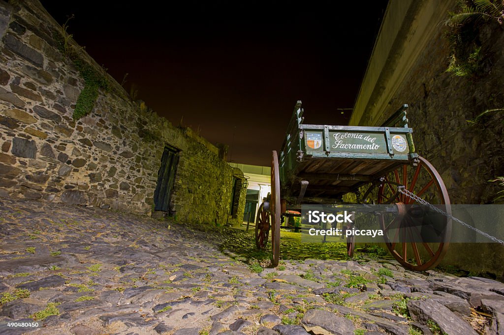 Wooden Wagon In Colonia at night Uruguay - Colonia Del Sacramento - Decorative Wooden Wagon In The Street Of The Old Town / Vintage - Wooden Wagon at night. Horse Cart Stock Photo