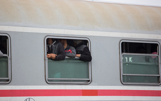 Tovarnik, Croatia - September 24, 2015: Syrian refugees on train in train station Tovarnik. Many refugees are crossing Hungary from Syria,Pakistan Afghanistan going to other countries of Europe as Germany,Austria,Dinamarc and others searching for better future for their families. Nobody wants to be refugee and no one of this people coming from this countries want to be, but they are running away to not be killed in any moment in Syria or Afghanistan.
