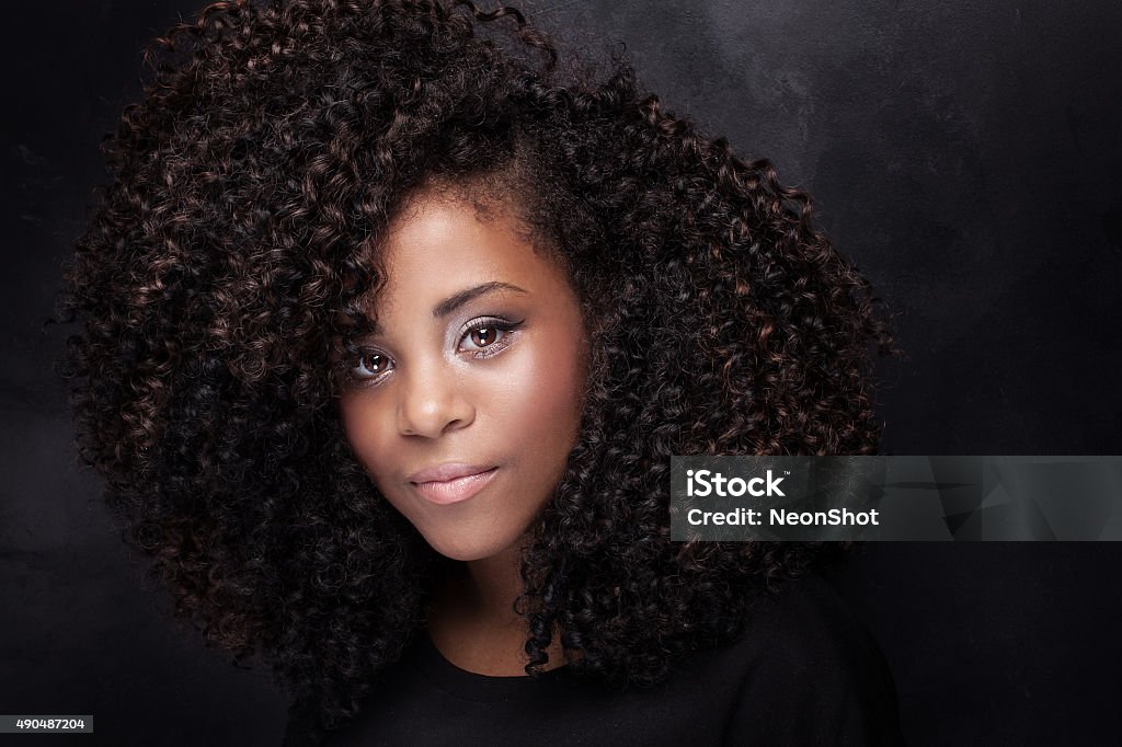 Beauty portrait of young girl with afro. Closeup beauty portrait of young african american girl with afro and glamour makeup. African Ethnicity Stock Photo