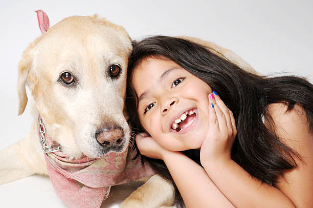 istock Girl with her Labrador 490487470