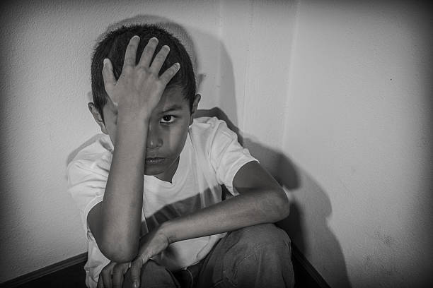 Young Asian boy, scared and alone Young Asian boy, scared and alone. Hoping for a better future than the one that seems set. He is at high risk of being physically, mentally and emotionally abused and also trafficked. Trafficking stock pictures, royalty-free photos & images